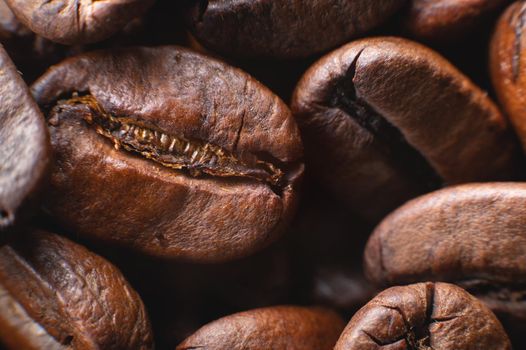 Close-up Coffee roasted beans. Extreme macro coffee background.