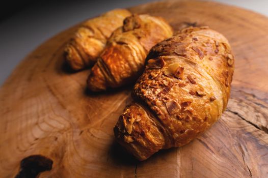 Close up of a bunch of delicious croissants on a dark background. Homemade croissants