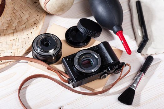 closeup vintage style of digital mirrorless camera with cleaning kits