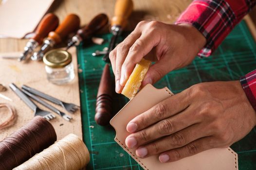 Working with vegetable tanned leather. Leather and the craft tools.