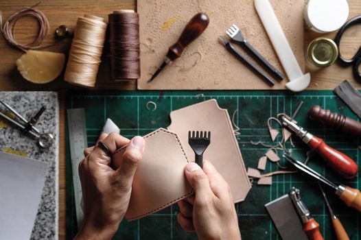 Working with vegetable tanned leather. Leather and the craft tools.