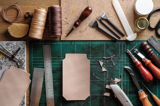 Working with vegetable tanned leather. Leather and the craft tools.