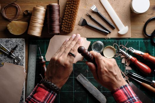 Working with vegetable tanned leather. Leather and the craft tools.