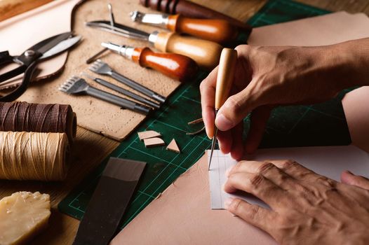 Working with vegetable tanned leather. Leather and the craft tools.