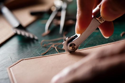 Working with vegetable tanned leather. Leather and the craft tools.