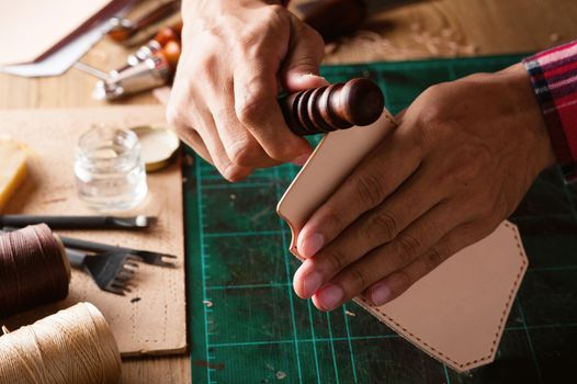 Working with vegetable tanned leather. Leather and the craft tools.