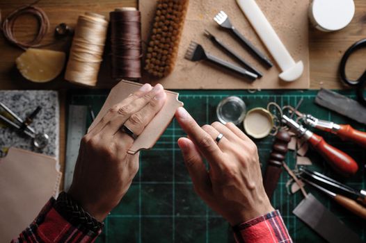 Working with vegetable tanned leather. Leather and the craft tools.