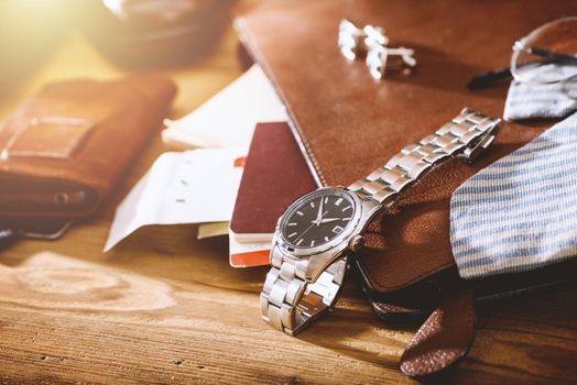 men's accessories, closeup at the luxury automatic wristwatch with black dial and stainless steel bracelet.