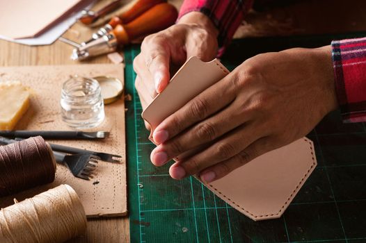 Working with vegetable tanned leather. Leather and the craft tools.