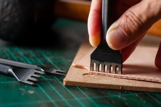 Working with vegetable tanned leather. Leather and the craft tools.