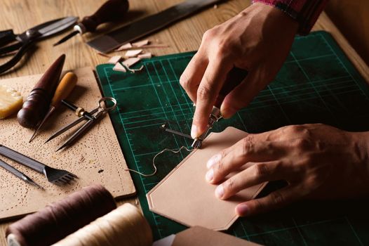 Working with vegetable tanned leather. Leather and the craft tools.