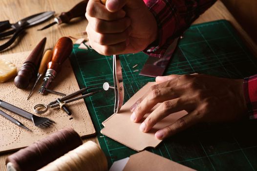 Working with vegetable tanned leather. Leather and the craft tools.