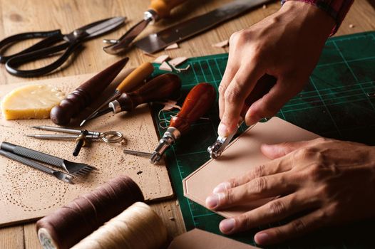 Working with vegetable tanned leather. Leather and the craft tools.