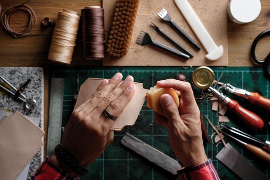 Working with vegetable tanned leather. Leather and the craft tools.