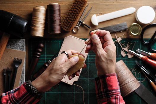 Working with vegetable tanned leather. Leather and the craft tools.