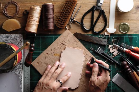 Working with vegetable tanned leather. Leather and the craft tools.