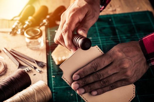 Working with vegetable tanned leather. Leather and the craft tools.