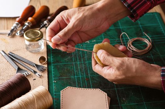 Working with vegetable tanned leather. Leather and the craft tools.