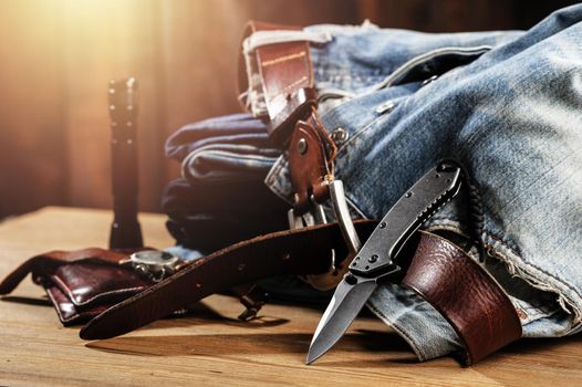 Pocketknife with old jeans in the background, pocketknife is one of every day carry (EDC) item for men.