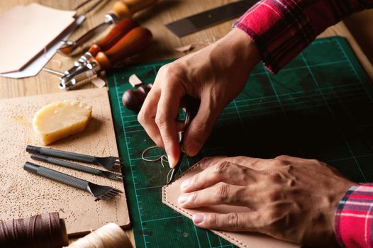 Working with vegetable tanned leather. Leather and the craft tools.