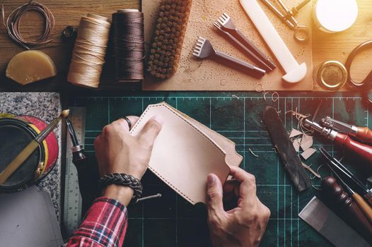 Working with vegetable tanned leather. Leather and the craft tools.