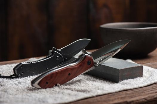 Sharpen the pocket knife with grindstone or whetstone. Pocket knife care and maintenance.