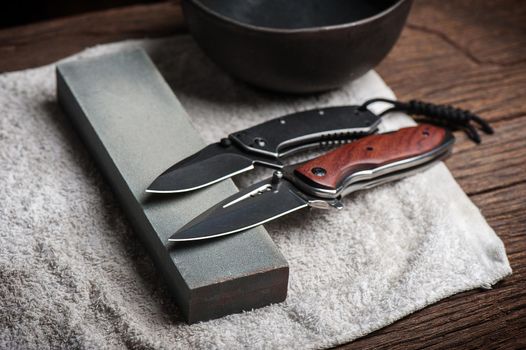 Sharpen the pocket knife with grindstone or whetstone. Pocket knife care and maintenance.