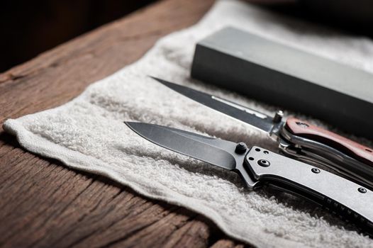 Sharpen the pocket knife with grindstone or whetstone. Pocket knife care and maintenance.