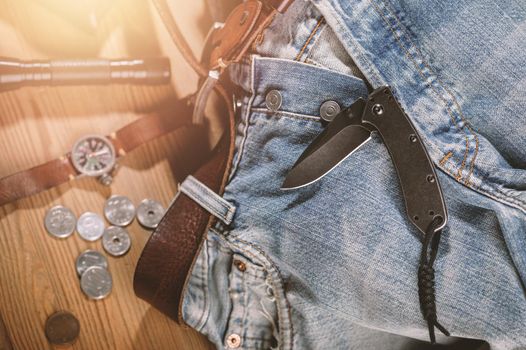 Pocketknife with old jeans in the background, pocketknife is one of every day carry (EDC) item for men.