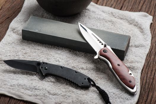 Sharpen the pocket knife with grindstone or whetstone. Pocket knife care and maintenance.