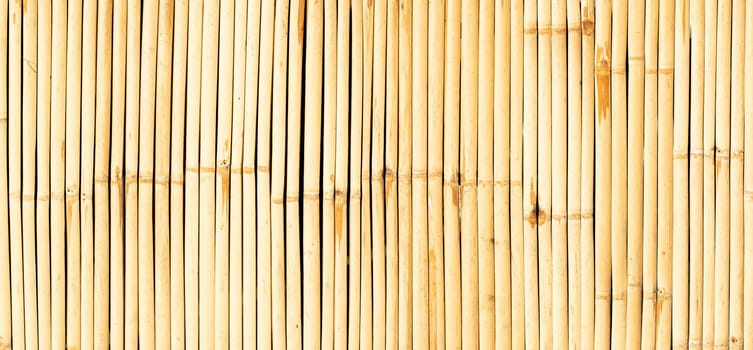 Seamless background of yellow wall bamboo. Nature wood material for traditional culture lifestyle