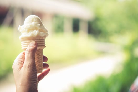 hand hold vanilla ice-cream holiday concept background idea