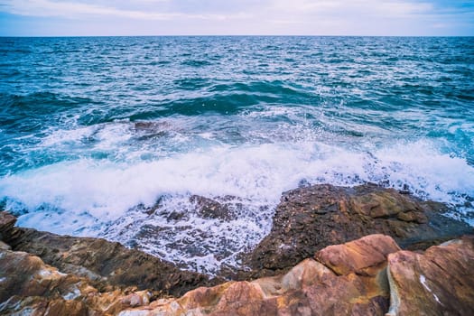 Sea with Smooth Wave and Rock landscape. Nature of Seascape in vacation holiday travel relax time.