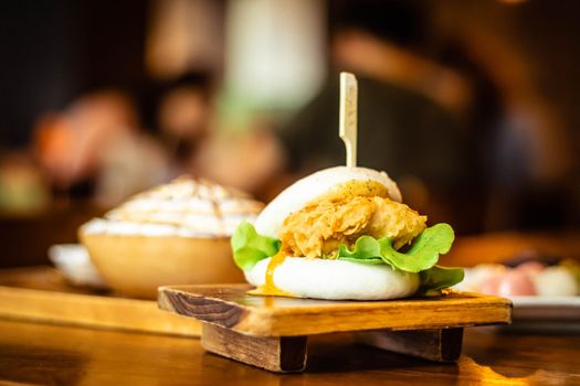 Selective focus Hirata Buns. Japanese traditional food. Asian cuisine made from steamed buns stuffed with salad and delicious savory fillings,   sandwiches or tacos