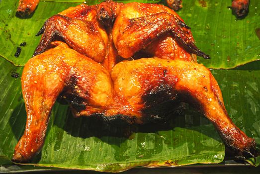 Thai grilled chicken on banana leaf is a delicious food in Asian Thailand