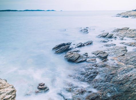 Long Exposure of Sea with Smooth Wave and Rock landscape. Nature of Seascape vacation holiday season time for relax travel