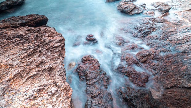 Long Exposure of Sea with Smooth Wave and Rock landscape. Nature of Seascape vacation holiday season time for relax travel