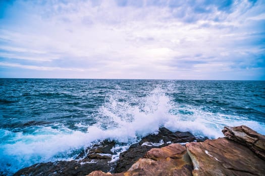Sea with Smooth Wave and Rock landscape. Nature of Seascape in vacation holiday travel relax time.