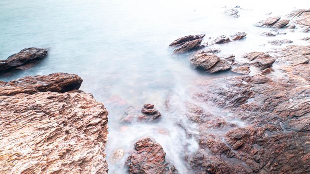 Long Exposure of Sea with Smooth Wave and Rock landscape. Nature of Seascape vacation holiday season time for relax travel