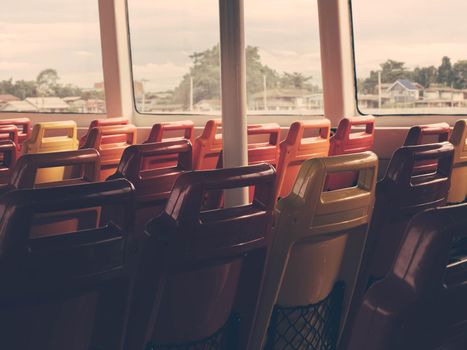 Hot colorful of Empty Seats on a Ferry boat for travel along Chao Phraya River.