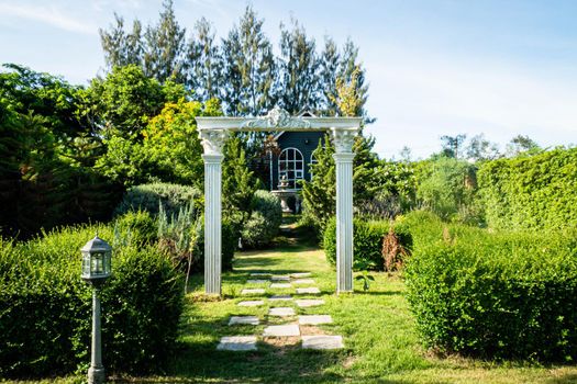 Stunning Entrance Portico Gate classic style decoration of a Public Garden. Column Stone structure element in classic architecture detail