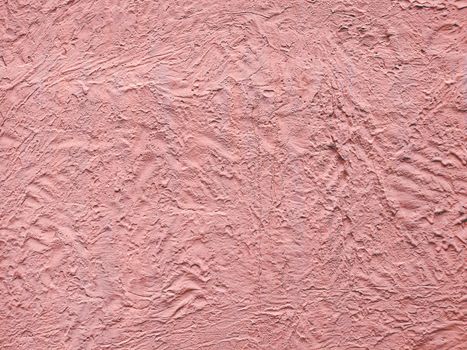 Pink textured stucco wall abstract background. Wall material in architecture and interior decoration idea.