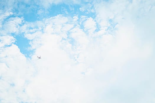 An airplane in Blue Sky Background With white Clouds. abstract sky summer season weather.