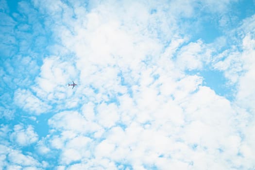 An airplane in Blue Sky Background With white Clouds. abstract sky summer season weather.