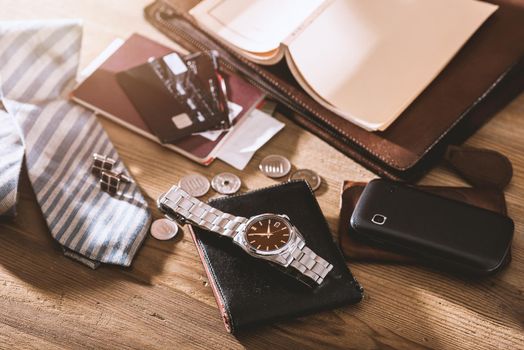 men's accessories, closeup at the luxury automatic wristwatch with black dial and stainless steel bracelet.