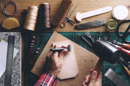 Working with vegetable tanned leather. Leather and the craft tools.