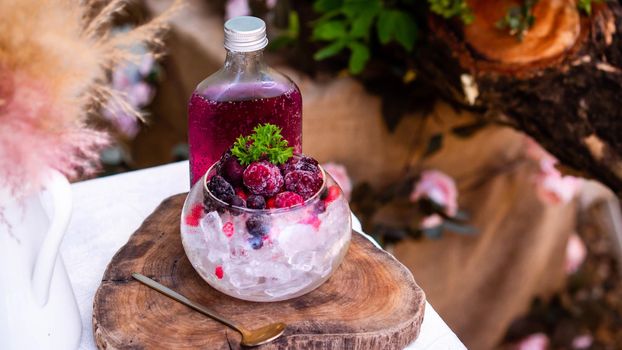 delicious non alcoholic Raspberry Mojito which combines fresh raspberries, juicy lime and crisp mint  and glass of iced.