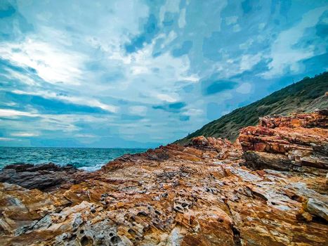 coast rock mountain at Khao Laem Ya National Park Rayong Thailand against blue sky background.