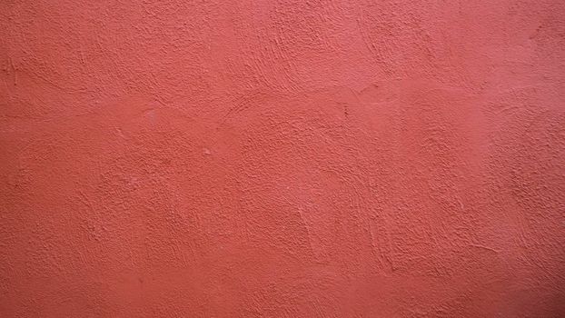 Abstract background from  red stucco concrete wall with sunlight, light and shadow
