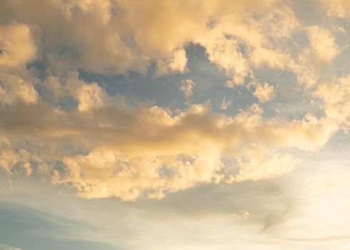 Dramatic clouds at sunset with cityscape silhouette. Abstract season weather vacation time.